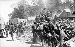 Men clearing debris