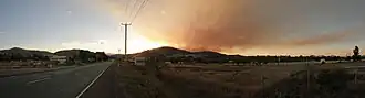 A Panoramic photo taken in Cambridge of bush fire smoke over the horizon.