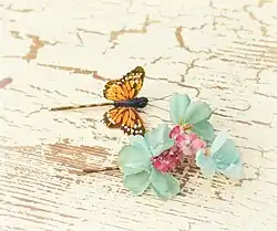 Image 47Butterfly and floral clips, worn in the mid- and late 1990s. (from 1990s in fashion)
