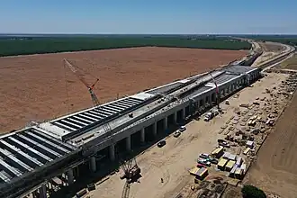 California High-Speed Rail crews are tying rebar to form the deck on the northern and southern portions of the pergola at the Wasco Viaduct – June 2022. (The railway angles across the top of the pergola.)