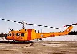 Base Flight Cold Lake CH-118 Iroquois helicopter 118103 at CFB Cold Lake, January 1992.