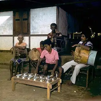 Tifa drums being played with totobuang gong chimes, in a tifa totobuang combination