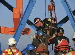 Attaching a strand to the hauling frame.