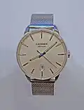 A watch with a fine stainless steel Milanese (dense and tight braided mesh variant) bracelet.[17]