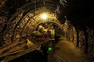 Tracing gallery with Alpine Miner digging machine at the Cagnac-les-Mines Departmental Mining Museum