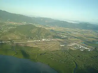 Aeroglen and Cairns Airport with Mount Whitfield directly behind it, as seen from the Coral Sea