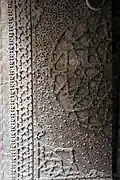 The mosque's metal doors, with geometric and arabesque patterns