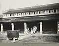 Mandarins in mourning dress in the funeral of emperor Khải Định going out of the hall, 1925.