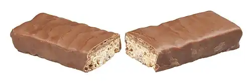 A Whatchamacallit candy bar broken in half, showing the peanut butter crisp.