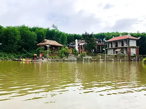 Flood-relief activities at Phổ Lại Pagoda, using boats to deliver essential aid to local communities during seasonal flooding