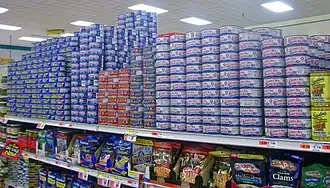 Small cans on grocery shelves