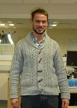 Image 40Man wearing shawl collar cardigan and hipster-inspired beard, 2011. (from 2010s in fashion)