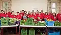 Volunteers of Caritas Vienna with fresh food produce.