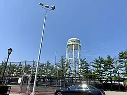 The Carle Place Water Tower, as seen from Charles J. Fuschillo Park in 2021