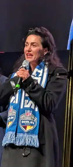 photo of Irsay-Gordon holding a microphone