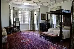 Master bedroom at Carrick Hill, featuring the oak tester bed