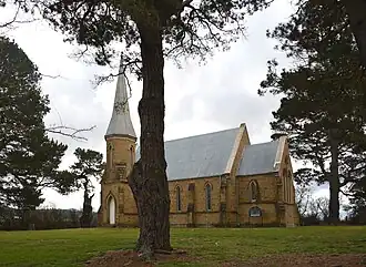St Thomas' Anglican church lies in the locality of Primrose Valley and the civil parish of Yanununbeyan, despite the sign indicating that it is in Carwoola. The church was completed in 1874.