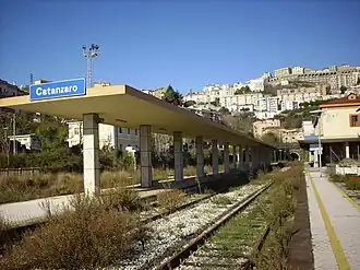 View of the abandoned station in 2010. In background the city centre and the tunnel of Sansinato. In the left side, behind the roof, it is possible to see the FC station building.
