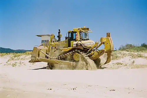 A Caterpillar D9N equipped with a single-shank ripper