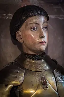 Joan of Arc sporting the characteristic bowl cut of the first half of the 15th century. Sculpture created in 1937, Strasbourg Cathedral.