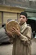 An Egyptian adolescent playing the riqq
