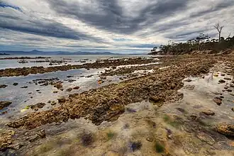 Cemetery Bay is located nearby.