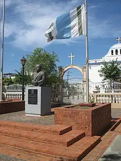 Vega Alta central plaza, municipal flag of Vega Alta and Catholic church