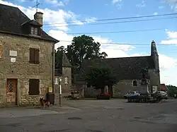 The church and surrounding buildings in Champagnac-la-Prune
