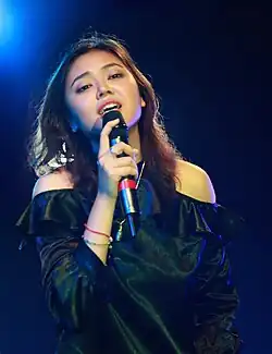 Mg Cho performing during her music concert in March 2019