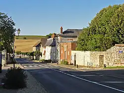 The main road through the village, and the town hall in the centre