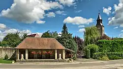 The wash house and church in Chaucenne