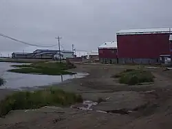 The school (blue), lake, and condemned old school (red)