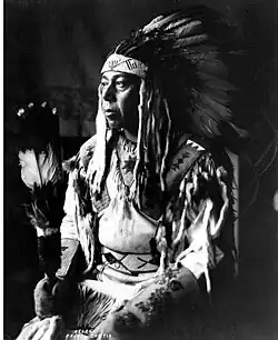 Chief Garry of the Spokane Indian tribe, in headdress and beaded shirt.