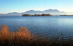 Krautinsel with (right) a small part of the Herreninsel island and in the background the Chiemgau Alps