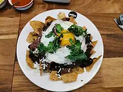 Chilaquiles negros uses black beans