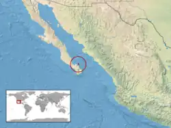 A small island off the eastern coast of baja california is coloured and circled in red