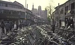 A very large number of bicycles parked along a street in Shanghai