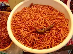 A dish of roasted chinicuiles in a market in Tula de Allende, Mexico