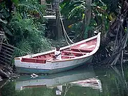 A child in a boat in Chiremena, a coastal village