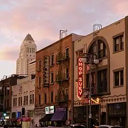 Three-story building with vertical "Chop Suey" sign
