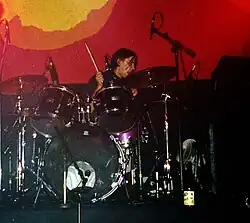 Acland performing with Lush