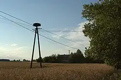 A white stork's nest atop an electricity pylon in the village