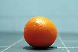 An orange. In 2022, oranges became popular with trans and nonbinary people starting in March.