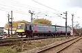 A Class 170 operated by CrossCountry approaching Ely station from the north
