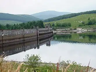 A lake surrounded by hills