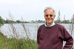 Clive Bell in front of a lake