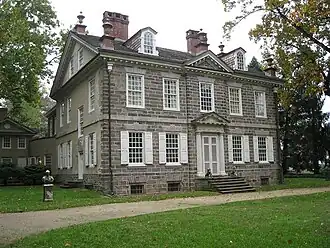 Left front on the house, showing servants' entrance at left