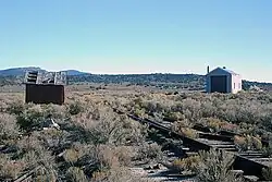 Surviving buildings in Cobre (September 2007). Both buildings were owned by the Nevada Northern Railway; the structure on the left is a handcar shed, and the structure on the right is an engine house.