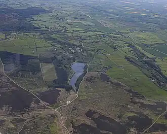 Aerial image of the reservoir surrounded my moorland and fields