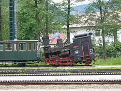 Schneeberg cog railway steam locomotive, with tilted boiler, on level track